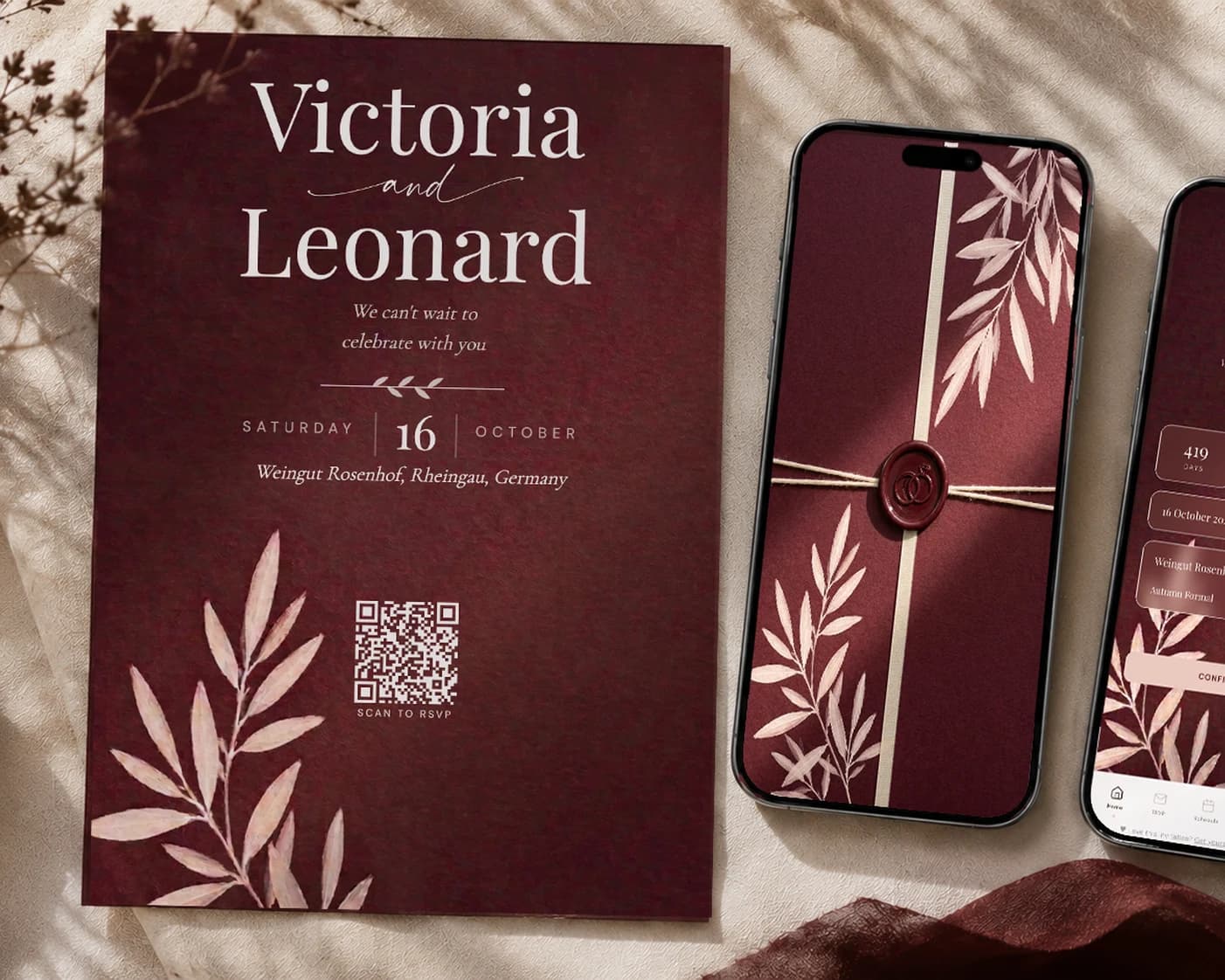 Burgundy wedding invitation suite on cream linen: printed deep wine invitation card with names, date and scan-to-RSVP QR code next to a phone showing the wax-sealed burgundy envelope