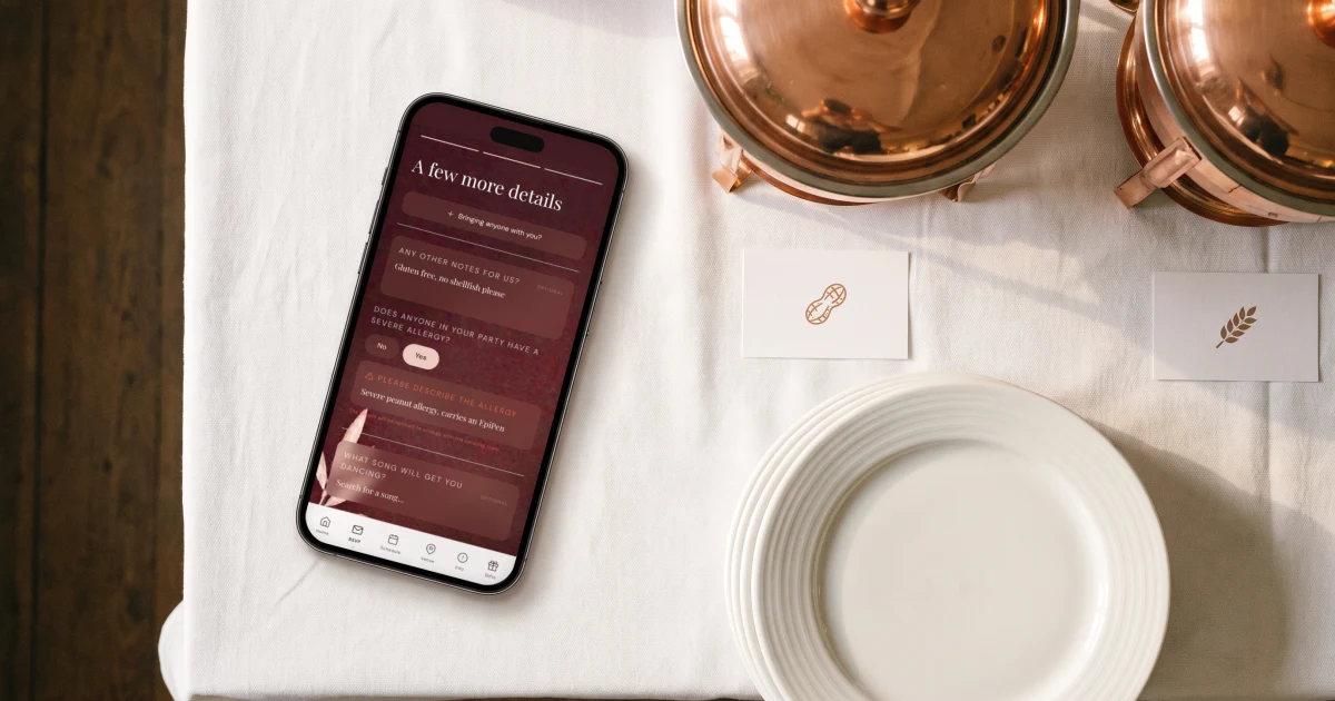 Buffet wedding RSVP: a phone shows the dietary and allergy question beside a buffet with allergen cards