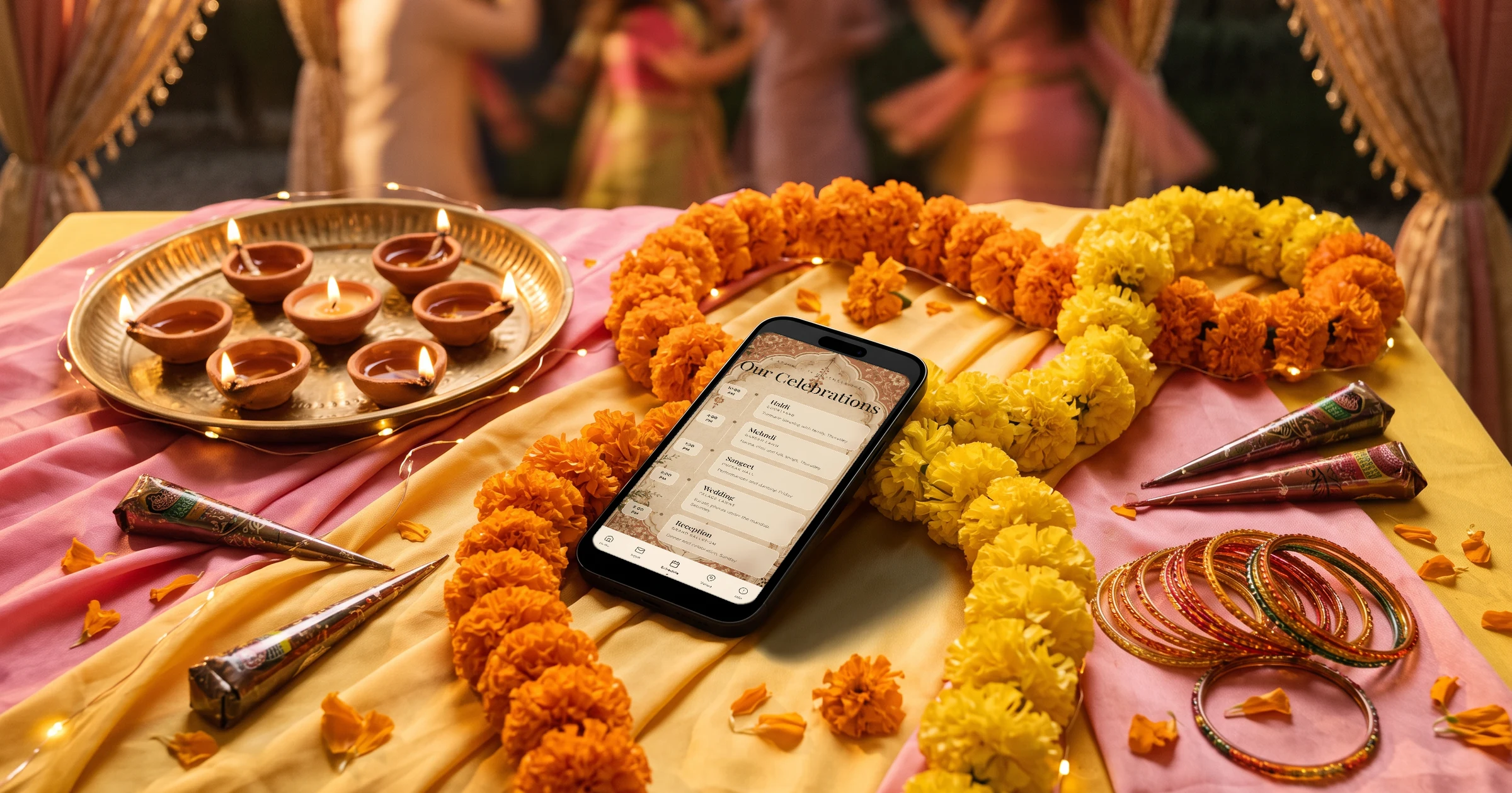Indian wedding schedule on a phone with haldi, mehndi, sangeet, wedding and reception, lying among marigold garlands on yellow and pink silk with henna cones, a brass thali of diyas and glass bangles