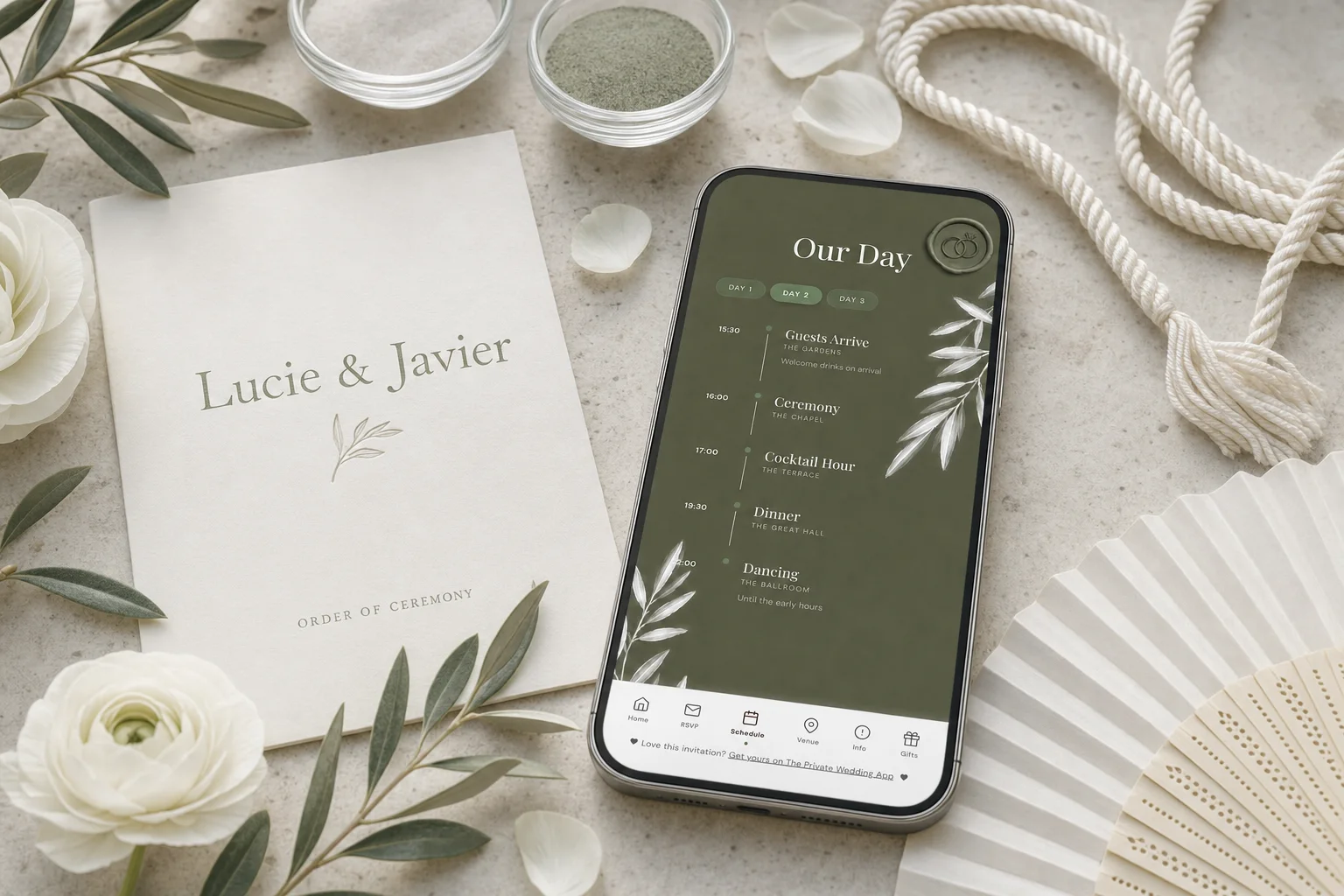 Symbolic wedding ceremony order: a phone shows the day's schedule from guest arrival and ceremony to dinner, beside an order of ceremony card, sand ceremony vessels and a handfasting cord